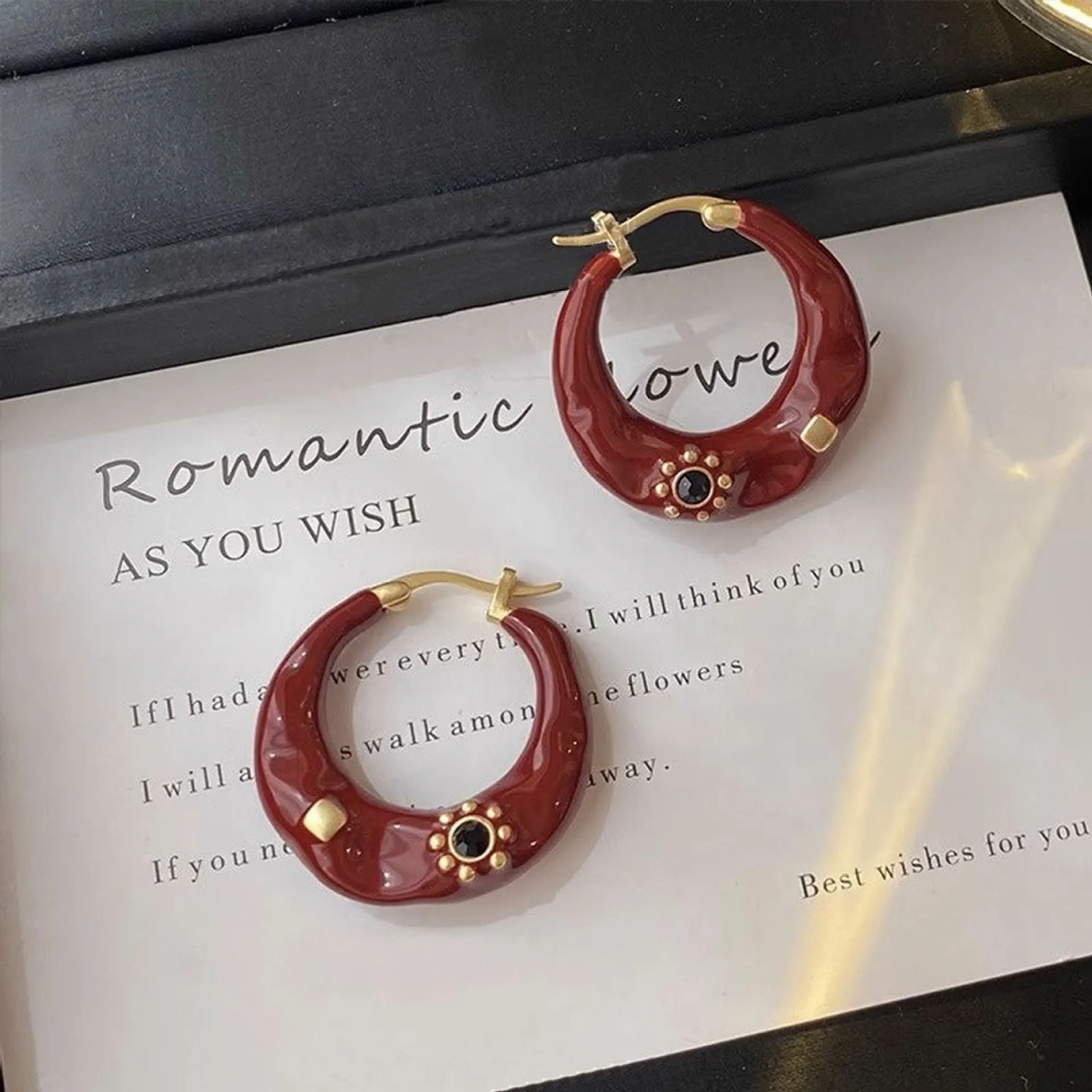Hong Kong style retro ear studs with rhinestone inlay and dripping oil texture in black and red colours