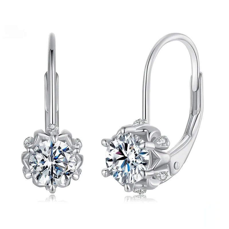 Sterling silver flower bud ear clips with white gold plating and a moissanite centre stone.