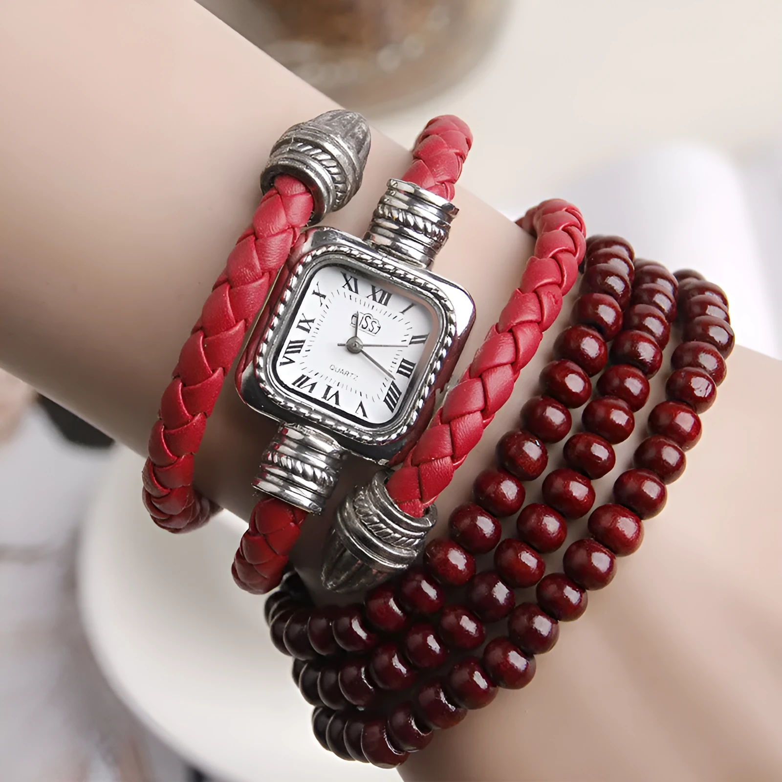 Snake bracelet quartz watch with leather strap and alloy buckle on a black background