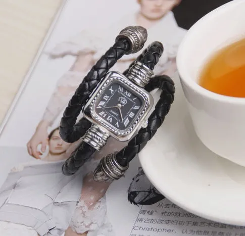Snake bracelet quartz watch with leather strap and alloy buckle on a black background