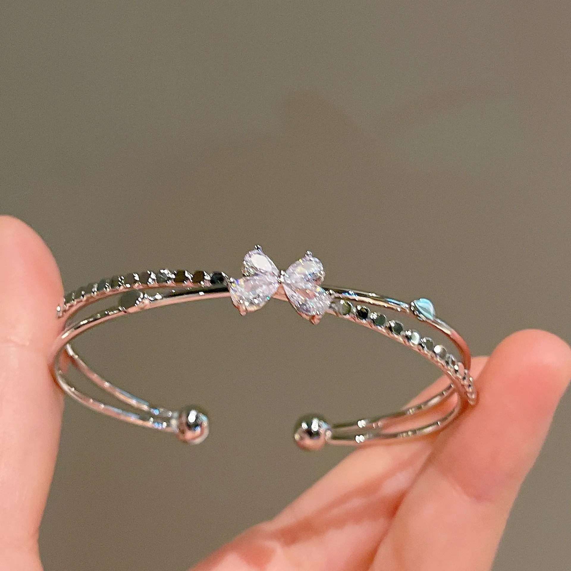 Women's silver electroplated copper bow bracelet with zircon stones minimal style