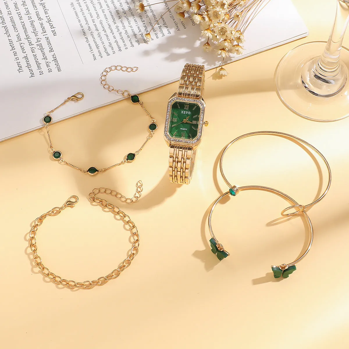Gold green women's square watch with four matching bracelets showing 25mm dial and alloy construction