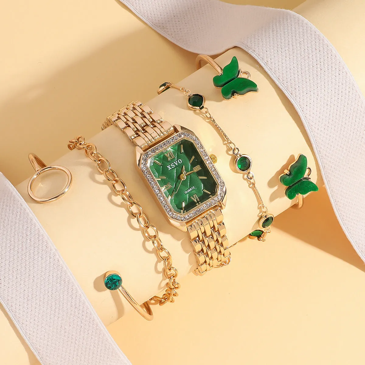 Gold green women's square watch with four matching bracelets showing 25mm dial and alloy construction