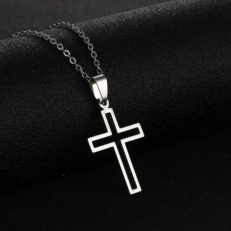 Stainless steel cross necklace on display showing O-shaped chain and pendant in steel colour finish