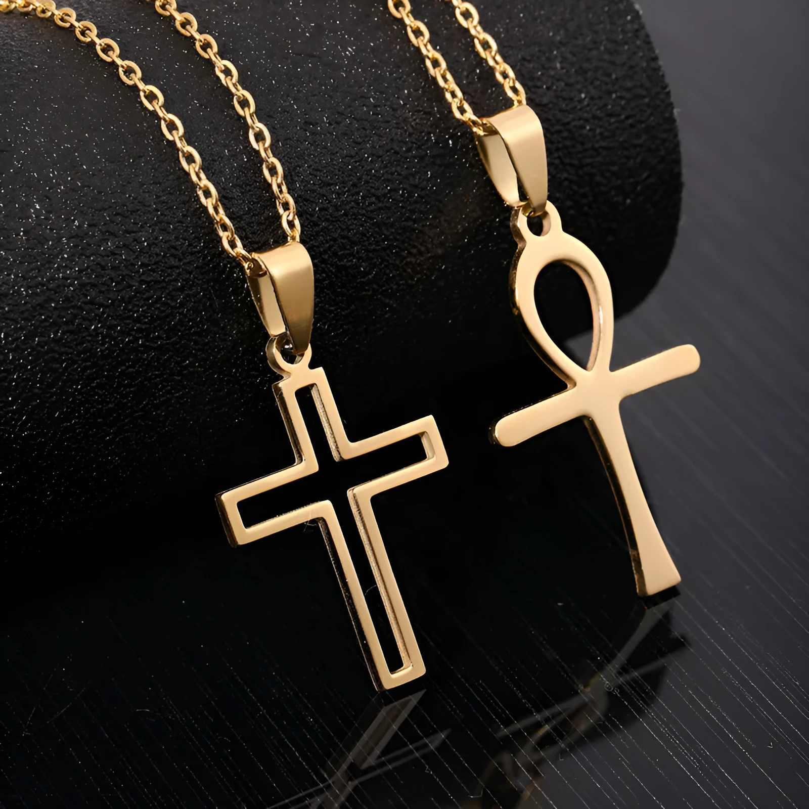 Stainless steel cross necklace on display showing O-shaped chain and pendant in steel colour finish