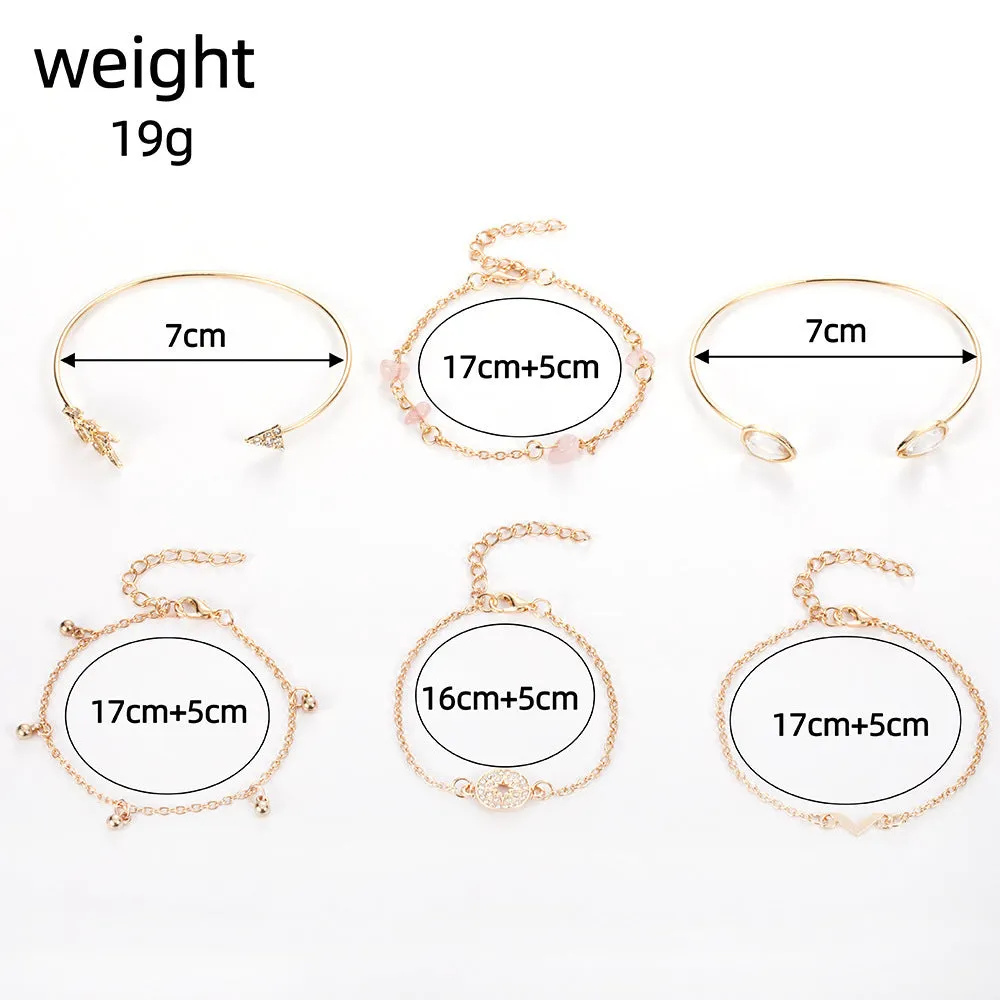 Gold zinc alloy bracelet set with water droplet and V-shaped designs for women.