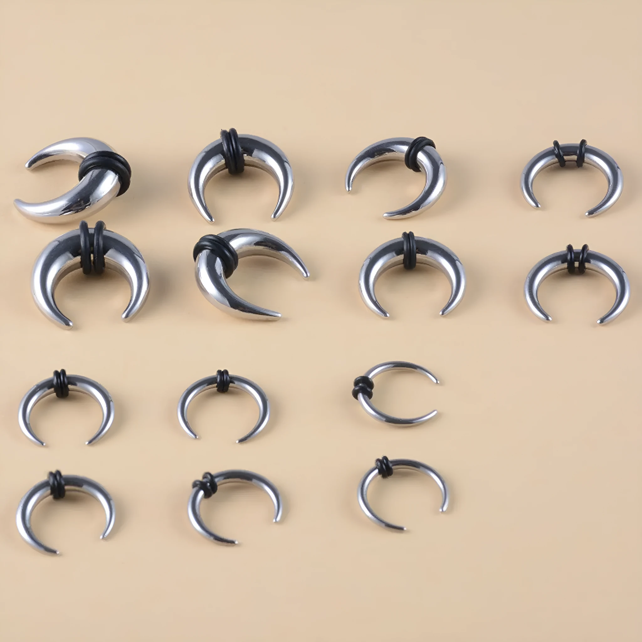 Curved C-shaped nose ring combining stainless steel and a brown buffalo horn segment.