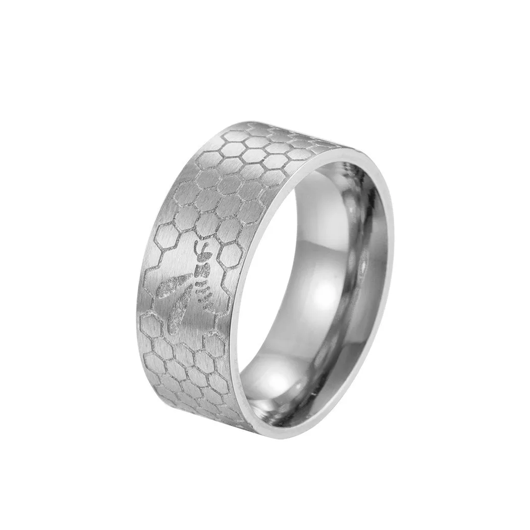 Stainless steel dopamine ring in gold finish with geometric pattern on a white background