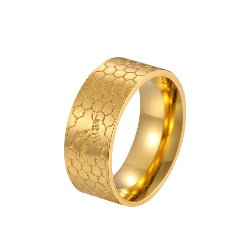 Stainless steel dopamine ring in gold finish with geometric pattern on a white background