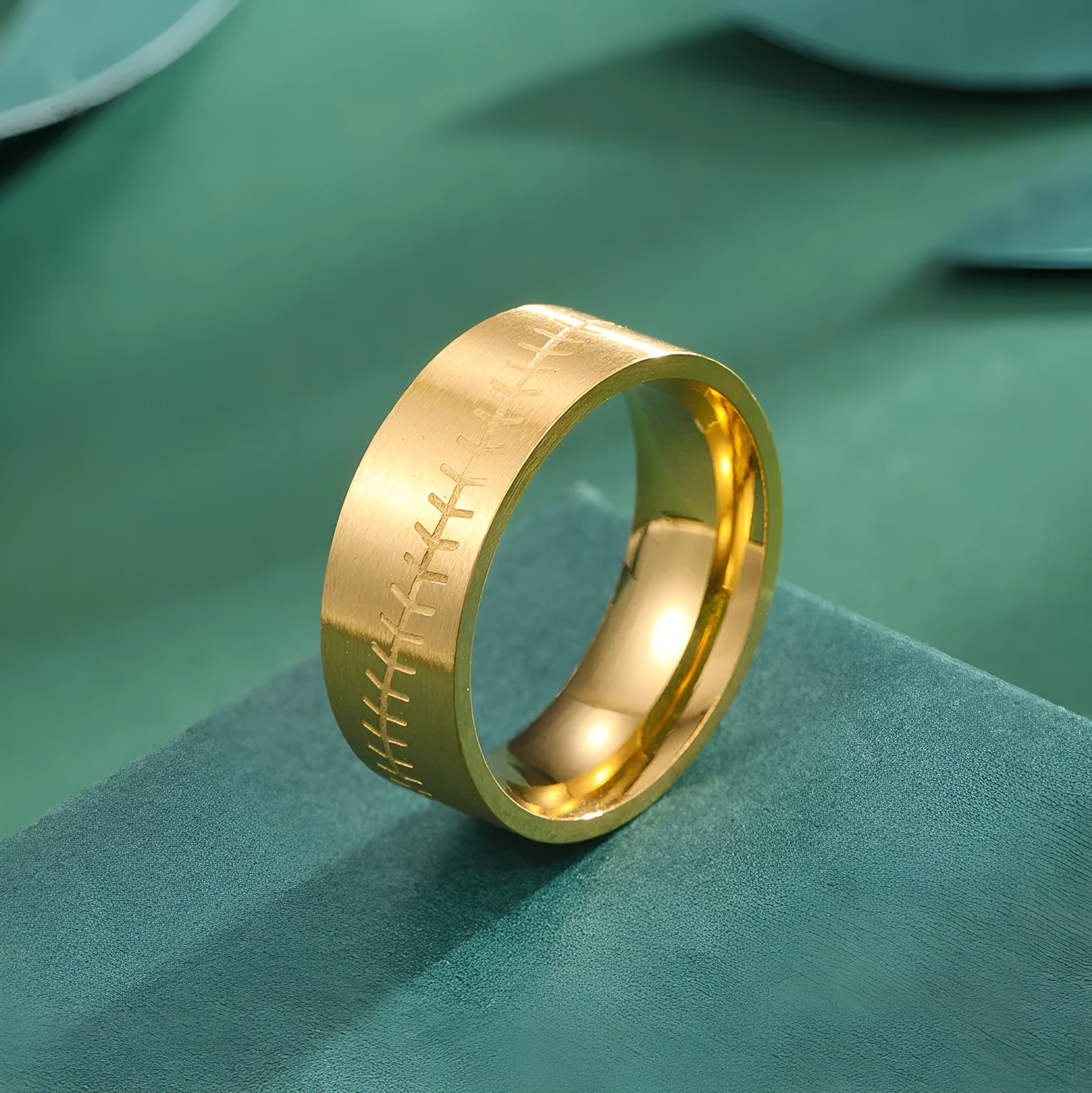 Stainless steel dopamine ring in gold finish with geometric pattern on a white background