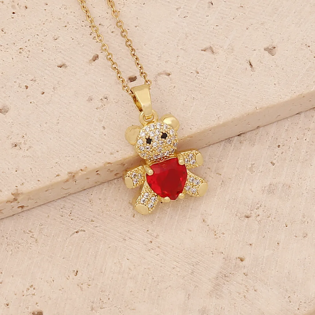 Copper micro inlaid zircon bear love gem necklace in green on a white background, adjustable 41-50cm