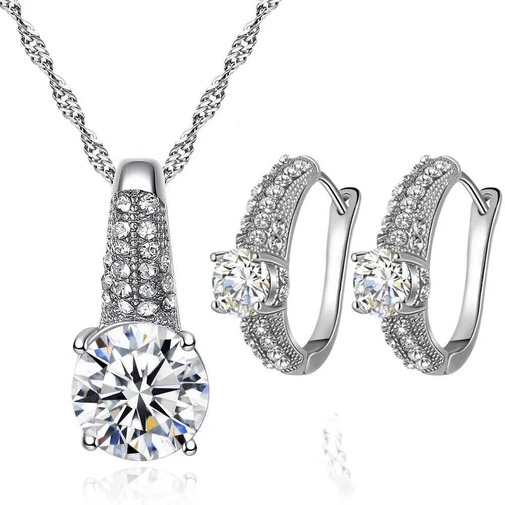 Gold and silver bridal necklace and earring set with copper base platinum finish on display