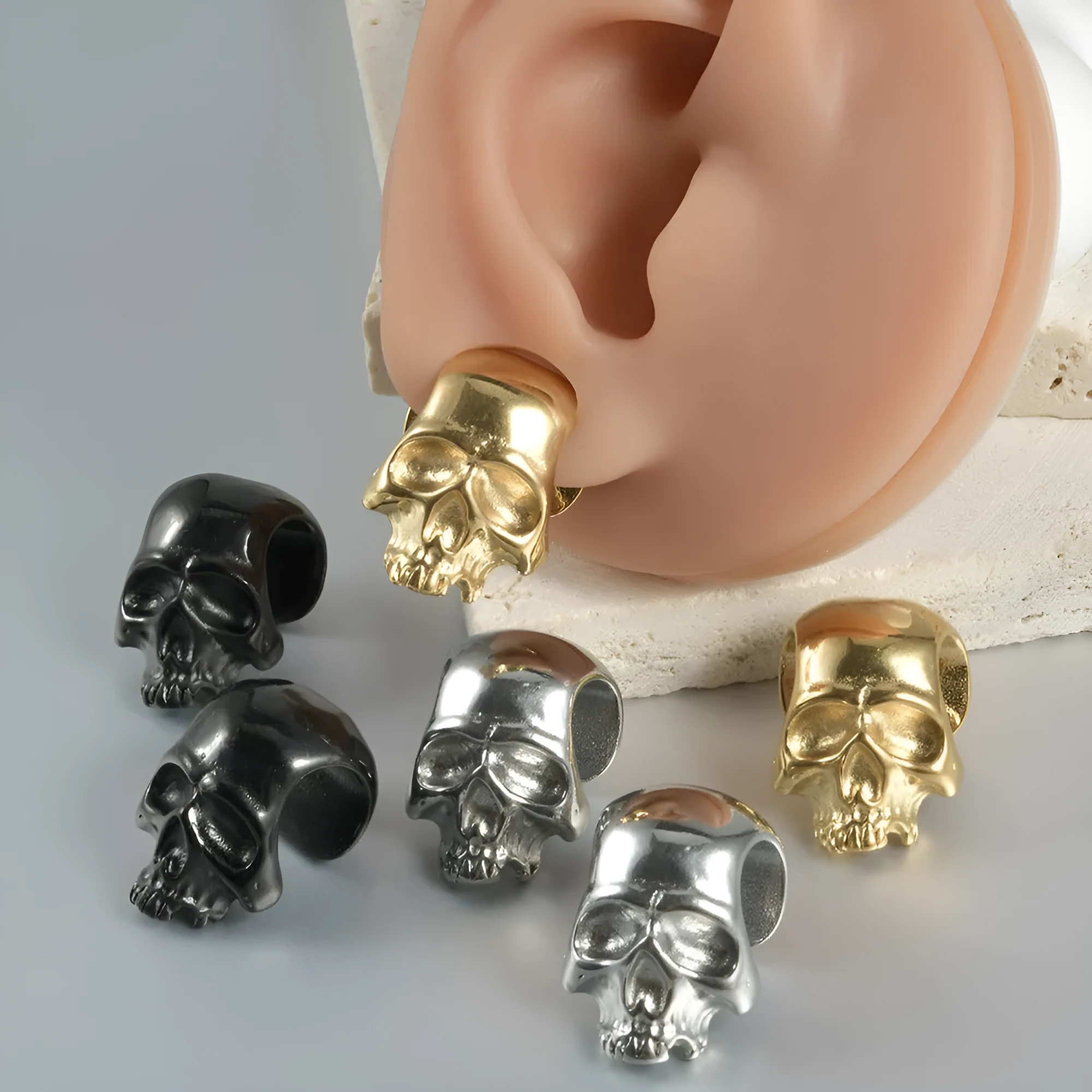 Personalised stainless steel hollow skull Buddha geometric earring in gold electroplate.