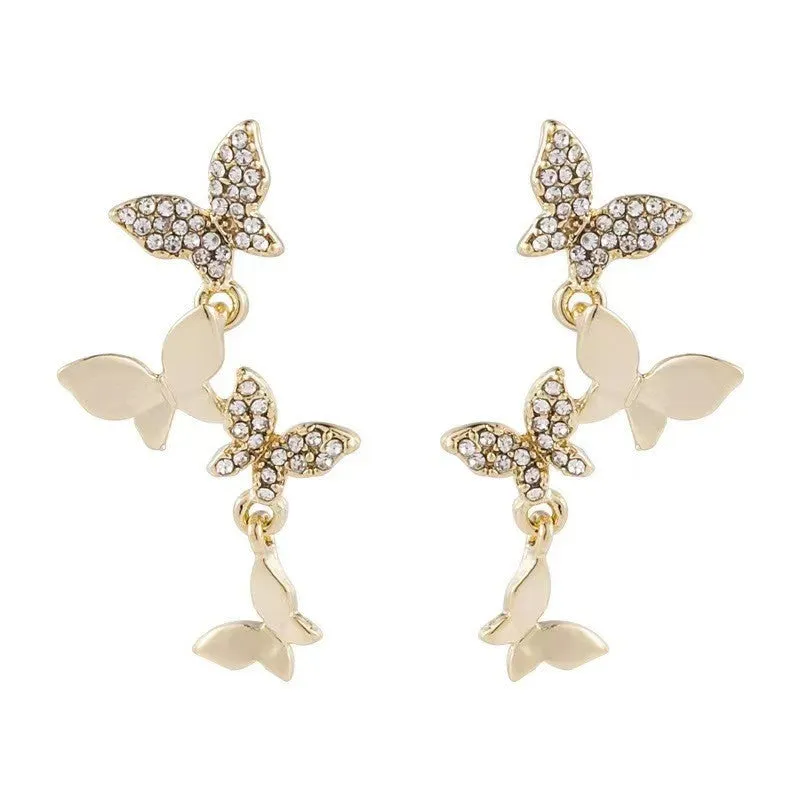 Women's gold-coloured copper butterfly earrings with four butterfly drop design