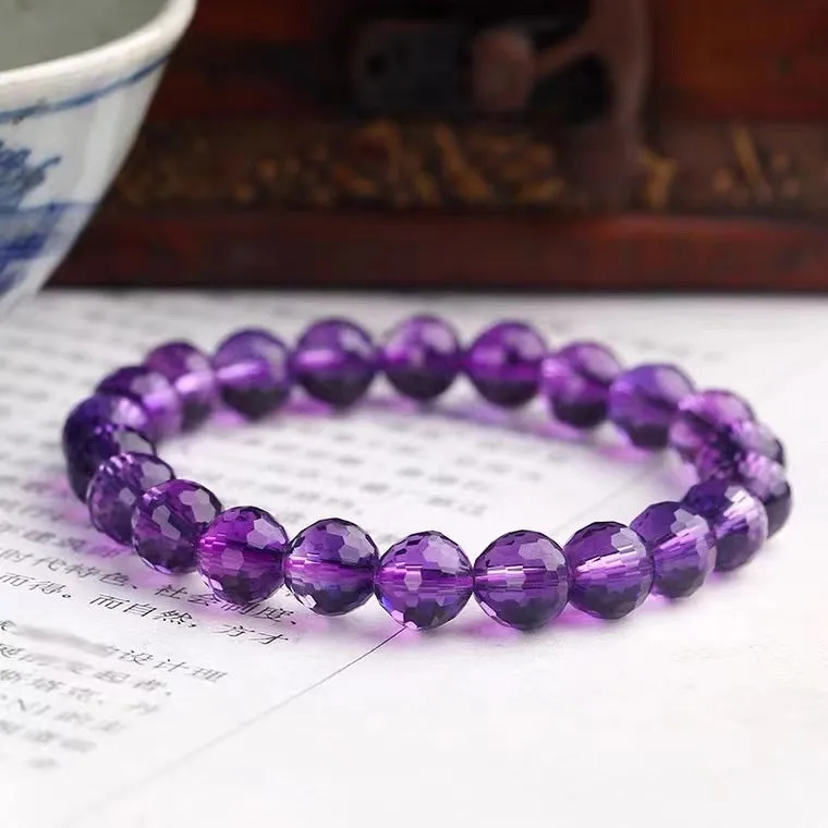 Handmade unisex bracelet with 128-faceted crystal beads and a decorative charm, available in multiple bead sizes.