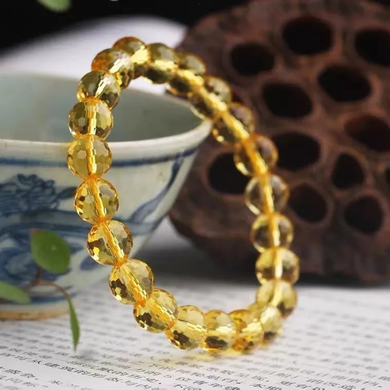 Handmade unisex bracelet with 128-faceted crystal beads and a decorative charm, available in multiple bead sizes.