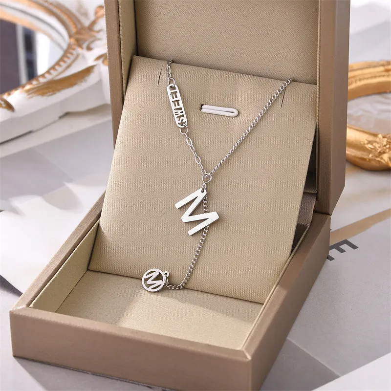 Titanium steel necklace with water wave chain and geometric mixed stone pendant in gold finish on woman