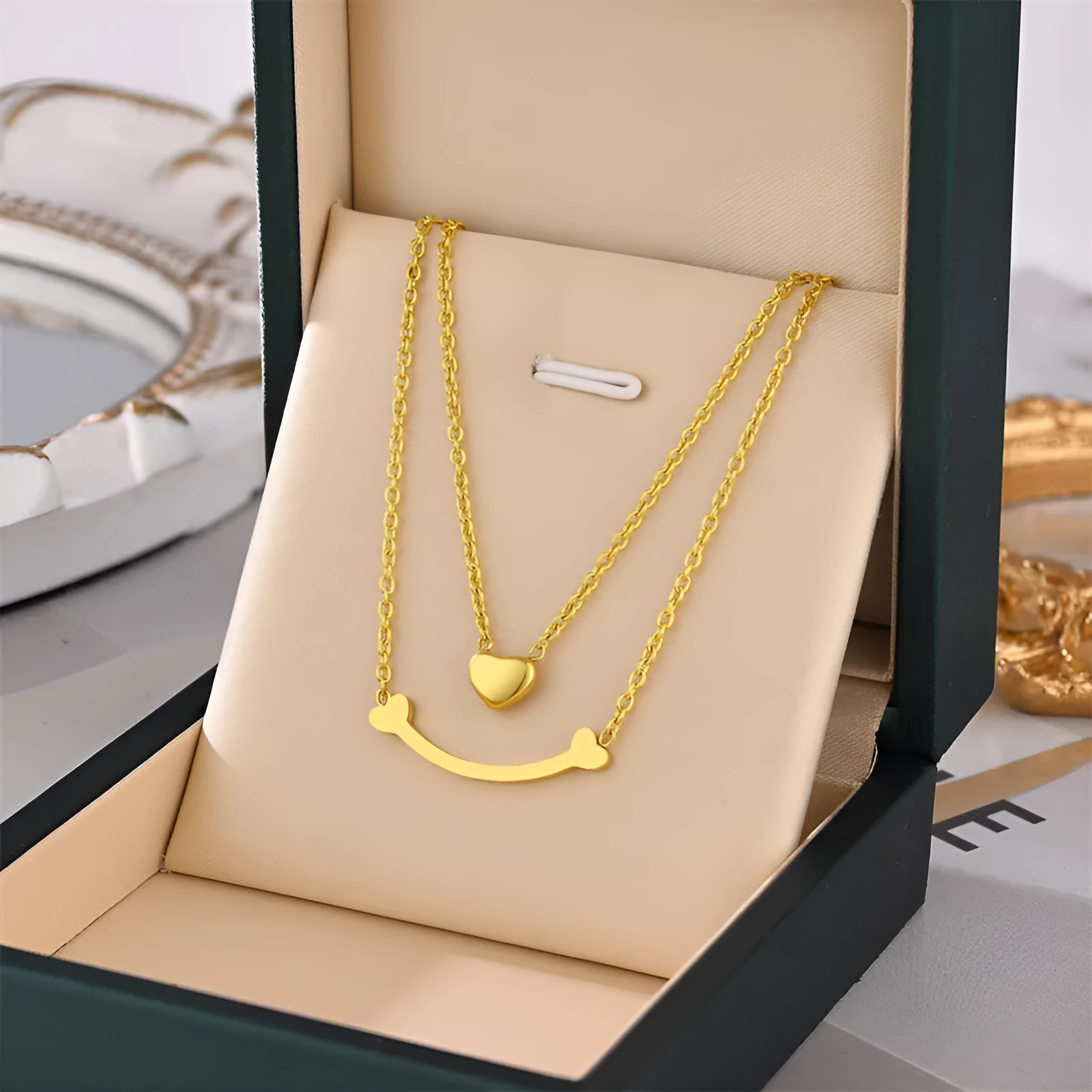 Titanium steel necklace with water wave chain and geometric mixed stone pendant in gold finish on woman