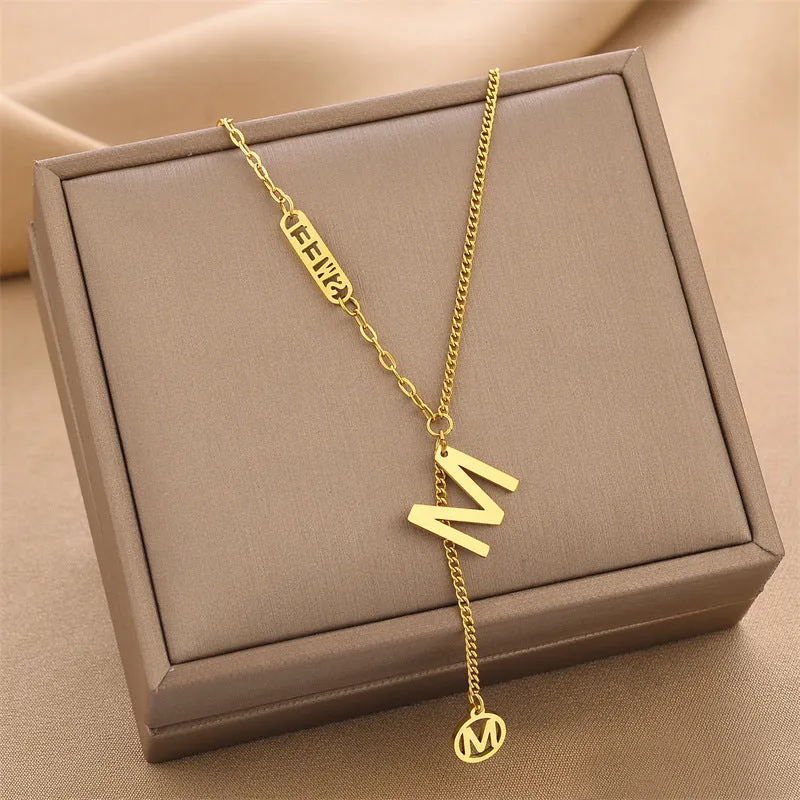 Titanium steel necklace with water wave chain and geometric mixed stone pendant in gold finish on woman
