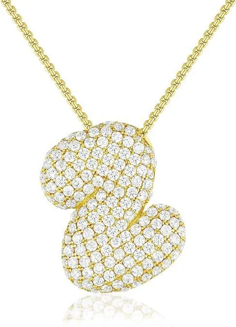 Brass zircon balloon English letter necklace in gold finish, copper base with inlaid zircon stones, on a woman's collarbone