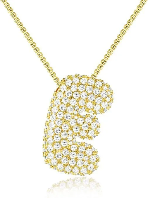 Brass zircon balloon English letter necklace in gold finish, copper base with inlaid zircon stones, on a woman's collarbone