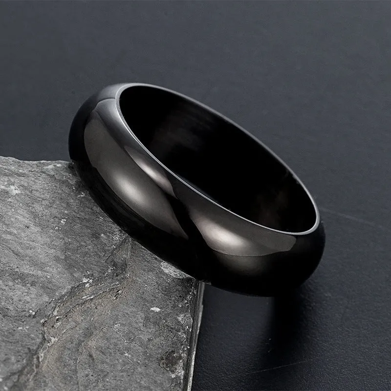 Glossy electroplated titanium steel ring shown in gold, black, and steel colour on a plain background.