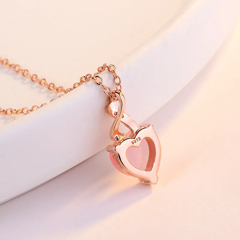 Women's heart-shaped pink artificial crystal pendant necklace on rose gold cross chain