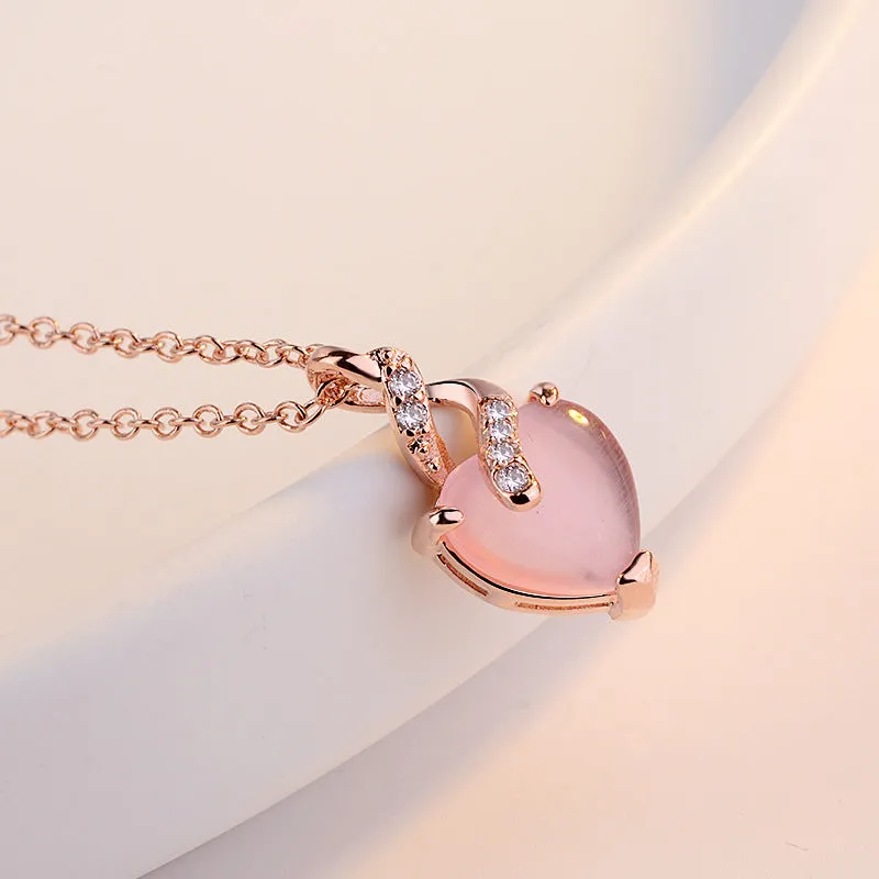 Women's heart-shaped pink artificial crystal pendant necklace on rose gold cross chain