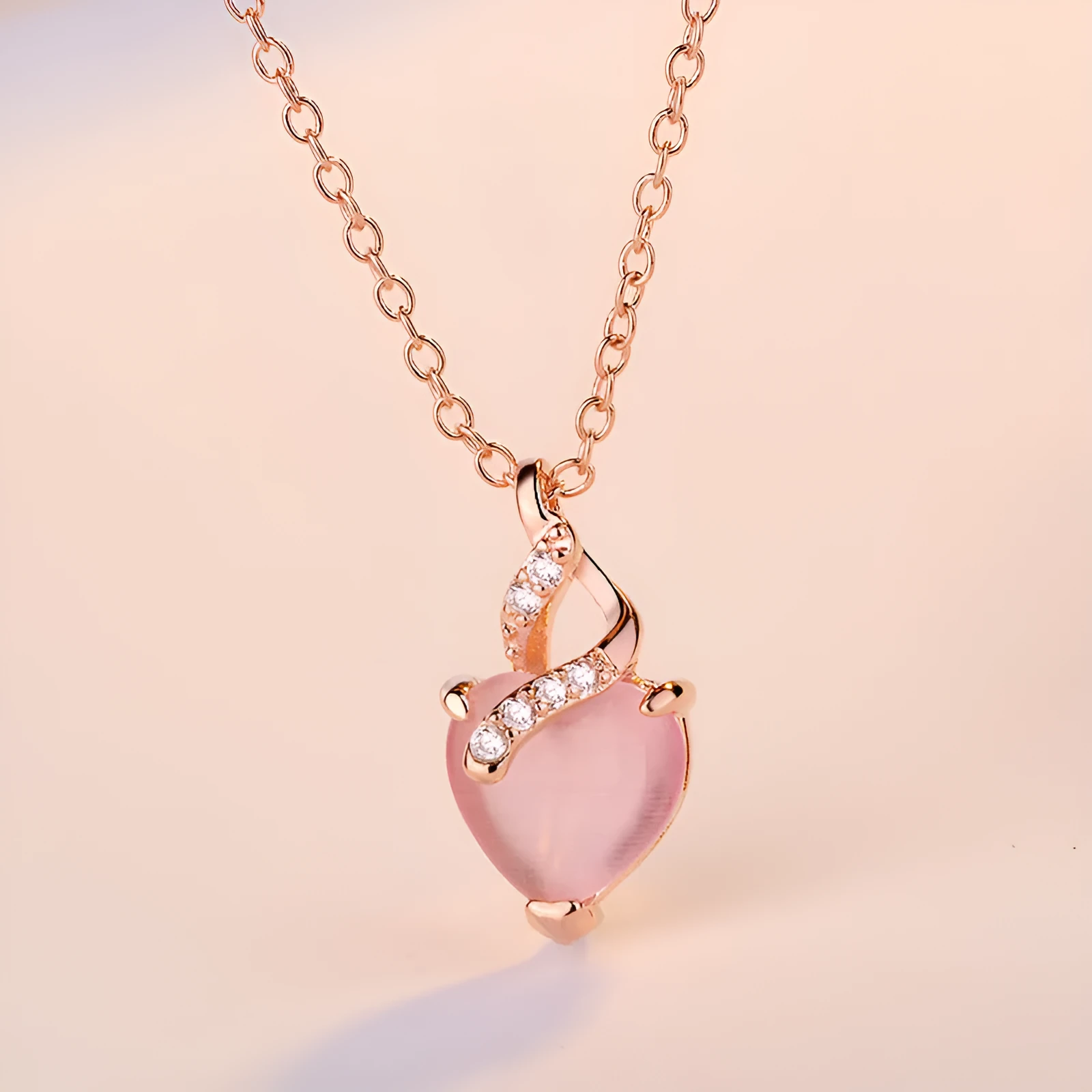 Women's heart-shaped pink artificial crystal pendant necklace on rose gold cross chain