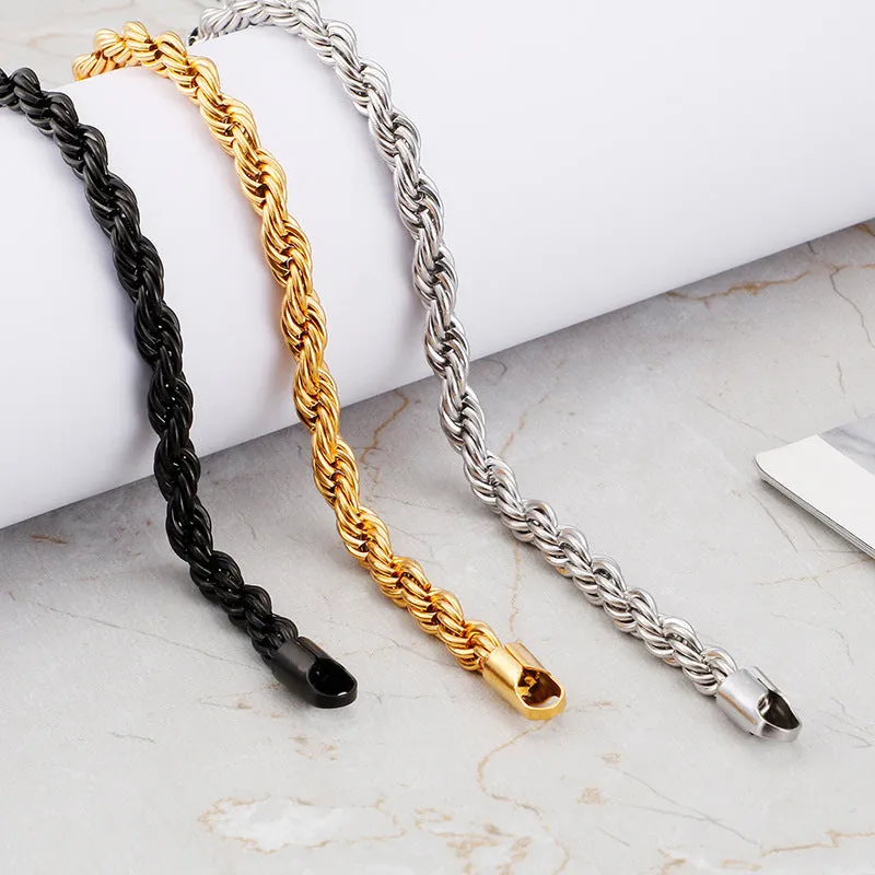 Gold double colour twist chain titanium steel bracelet with geometric design on white background