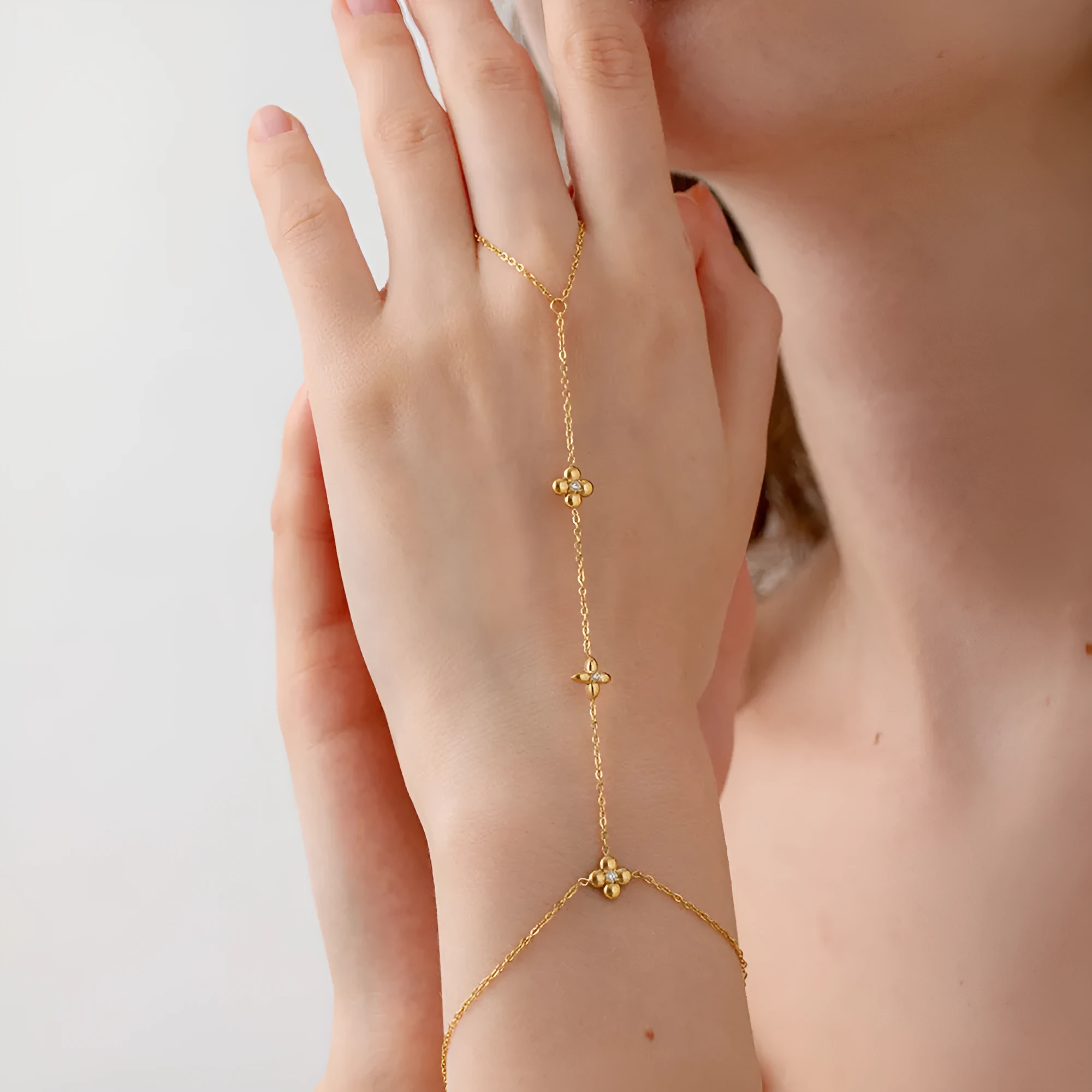 Women's stainless steel bracelet with geometric floral and eight-pointed star design in gold colour