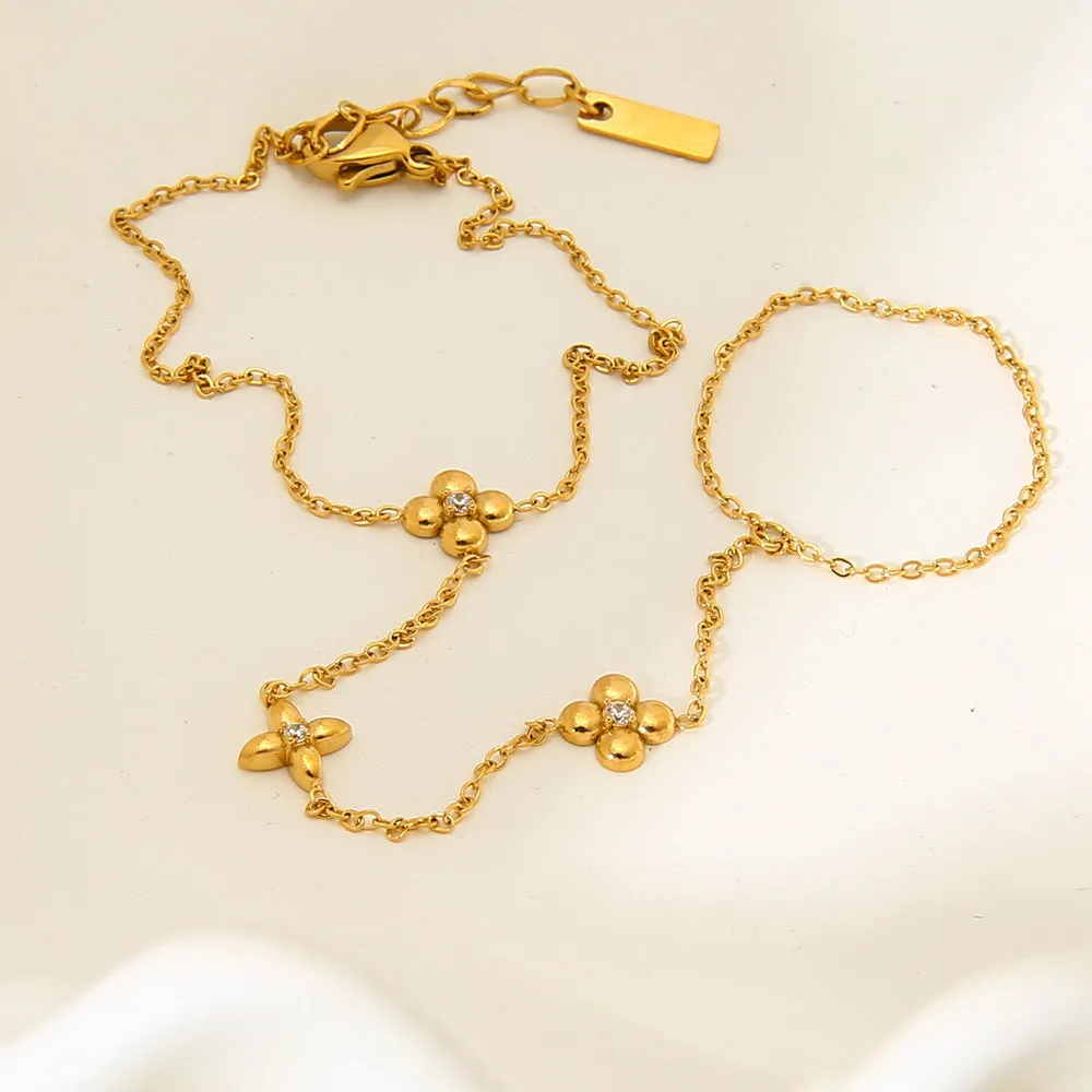 Women's stainless steel bracelet with geometric floral and eight-pointed star design in gold colour