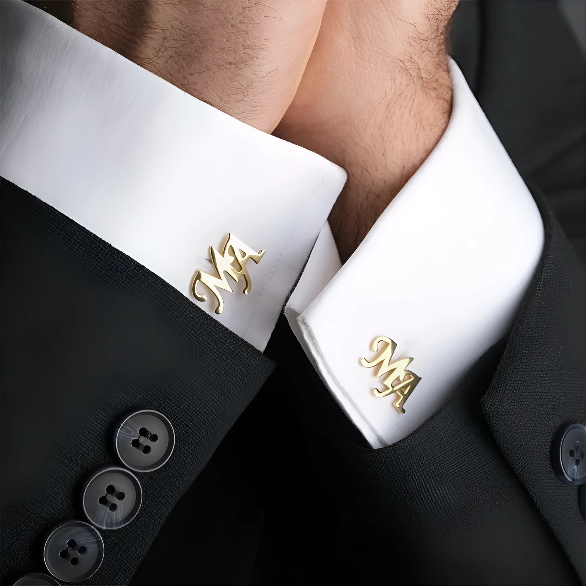 Handmade frosted personalised name abbreviation metal cufflinks in gold colour on a grey background