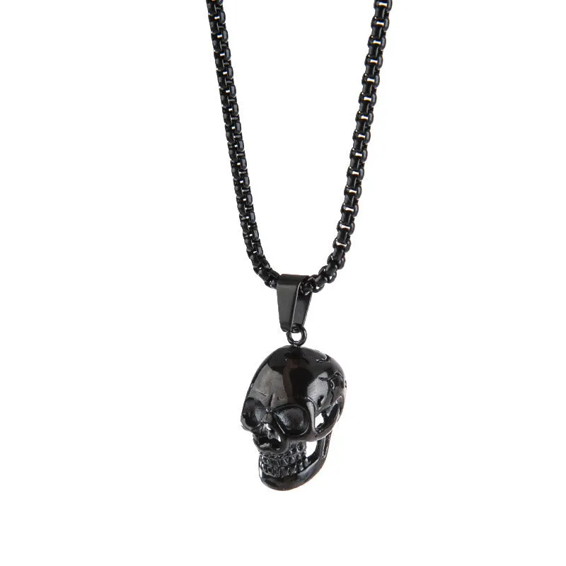 Halloween skull necklace in alloy and stainless steel with gold colour option on a black background