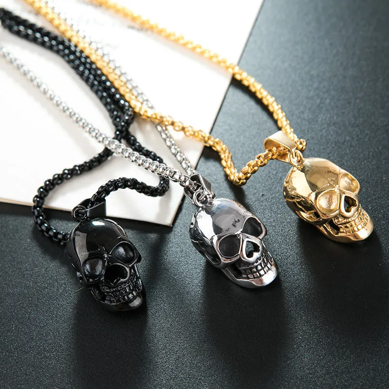 Halloween skull necklace in alloy and stainless steel with gold colour option on a black background