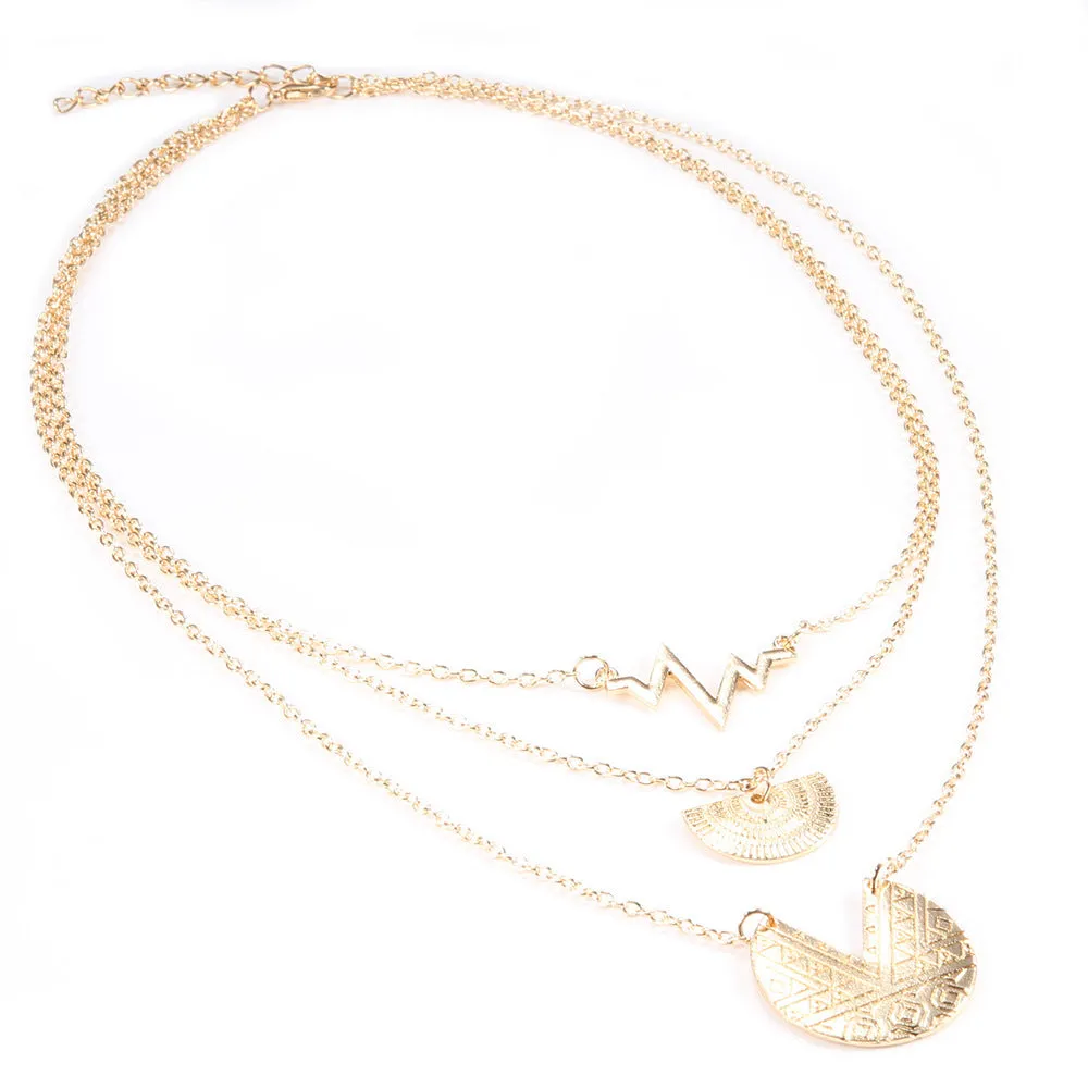 Gold multi-layer round alloy necklace with electroplated finish on white background
