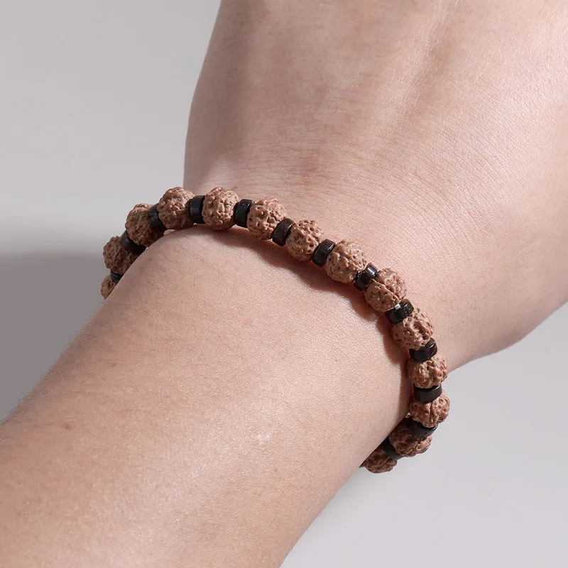 Brown volcanic stone agate beaded bracelet with rope chain on wrist