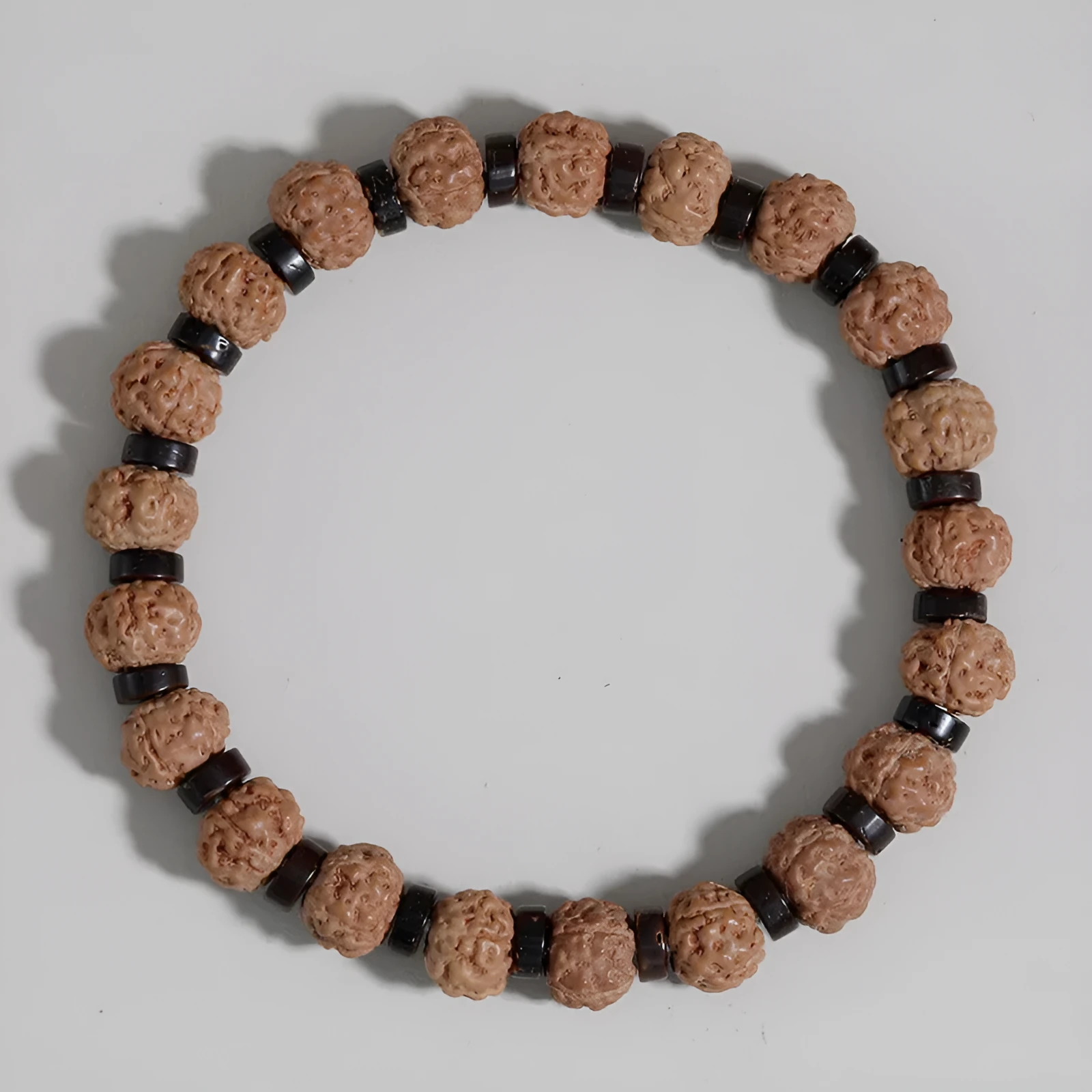 Brown volcanic stone agate beaded bracelet with rope chain on wrist