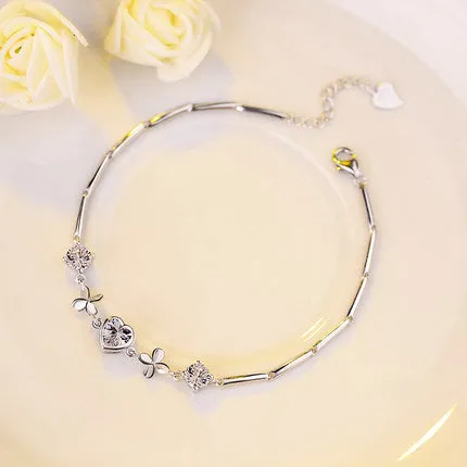 S925 sterling silver bracelet with heart-shaped four-leaf clover motif and extension chain