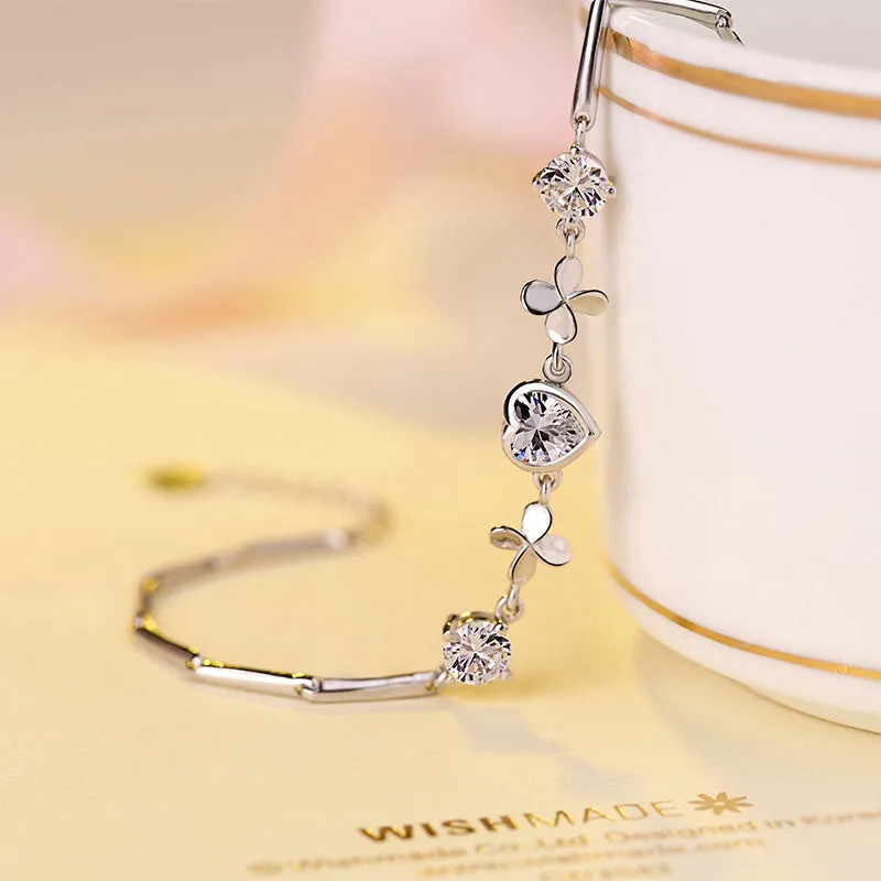 S925 sterling silver bracelet with heart-shaped four-leaf clover motif and extension chain