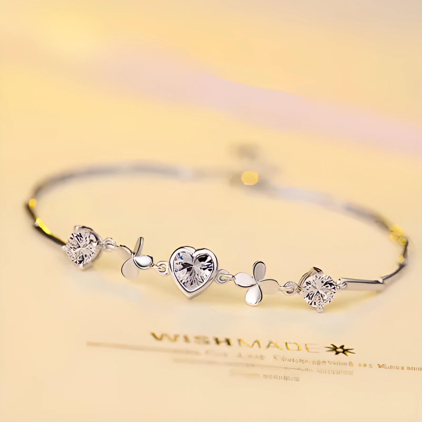 S925 sterling silver bracelet with heart-shaped four-leaf clover motif and extension chain
