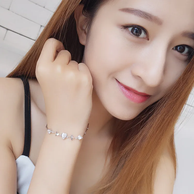 S925 sterling silver bracelet with heart-shaped four-leaf clover motif and extension chain