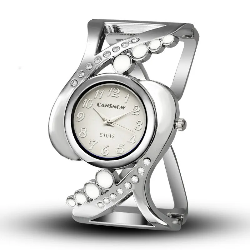 Ladies bracelet watch with white dial, stainless steel case, and alloy band on a neutral background