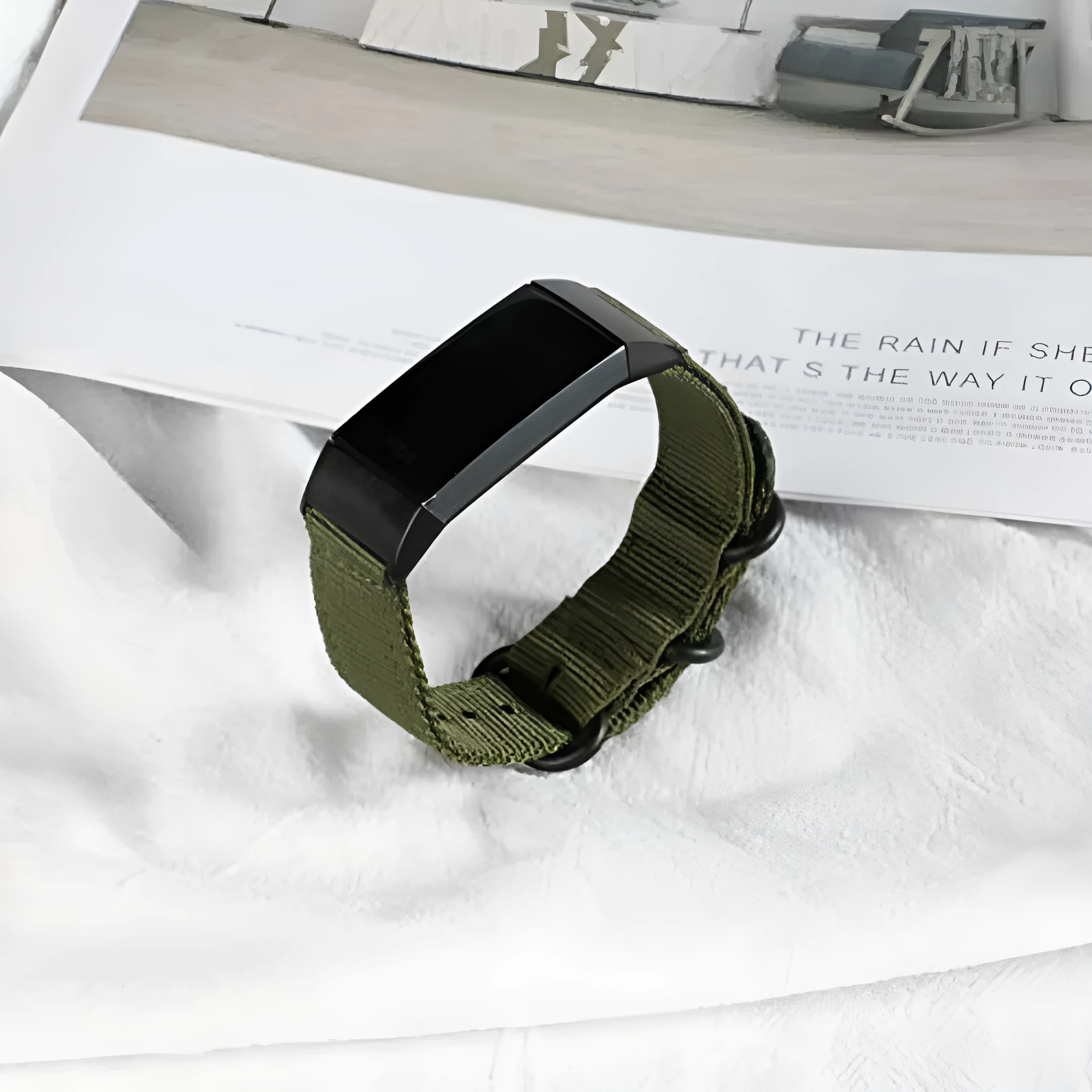 Army Green nylon replacement strap with a three-ring metal buckle for a Fitbit Charge 3 or Charge 4 fitness tracker.