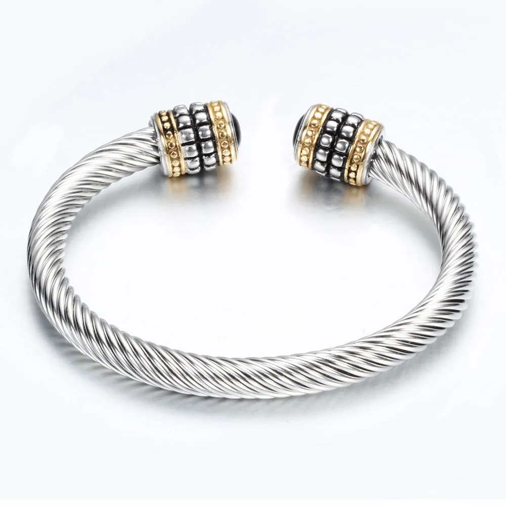 Two-tone vintage gold stainless steel bangle bracelet in black and golden finish