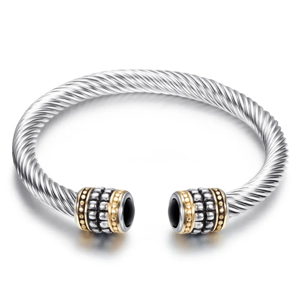 Two-tone vintage gold stainless steel bangle bracelet in black and golden finish