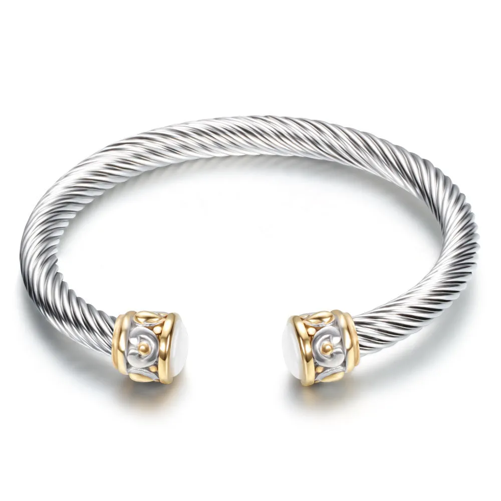 Two-tone vintage gold stainless steel bangle bracelet in black and golden finish