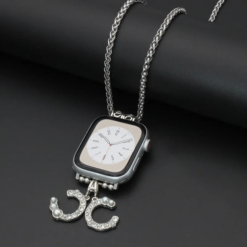 Nylon woven watch strap with feather hanging charm on a black watch face showing feather and Double C colour options