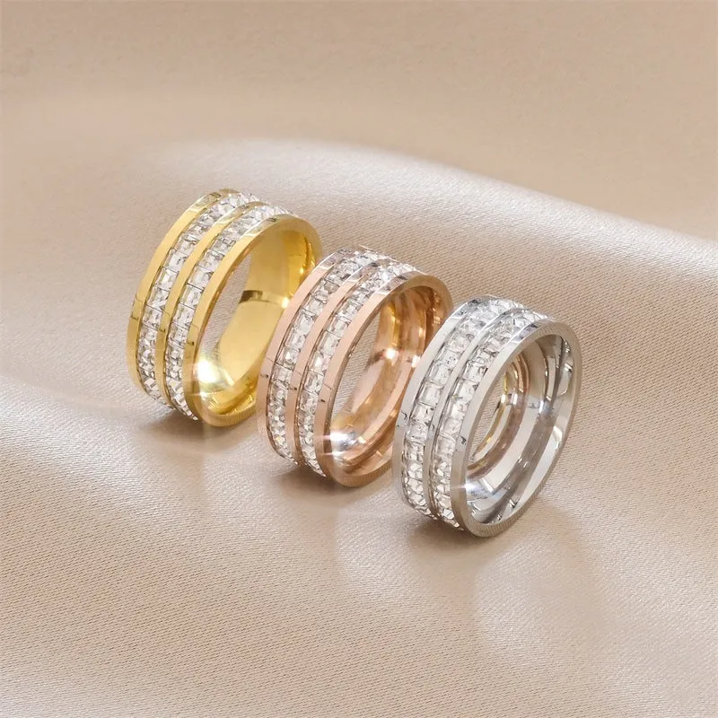 Stainless steel geometric star ring with zircon inlay in gold finish on white background