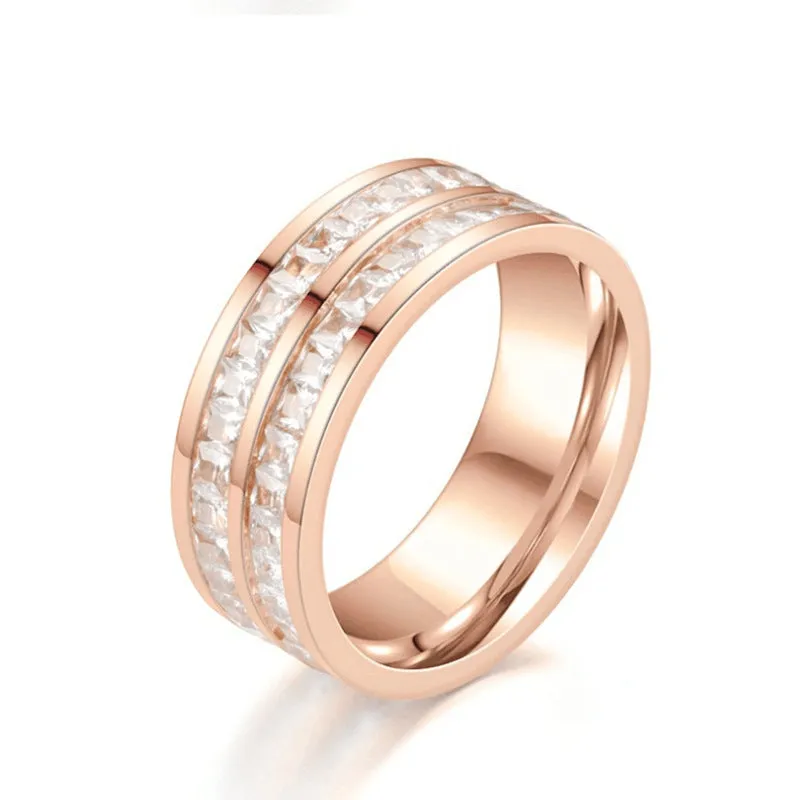 Stainless steel geometric star ring with zircon inlay in gold finish on white background